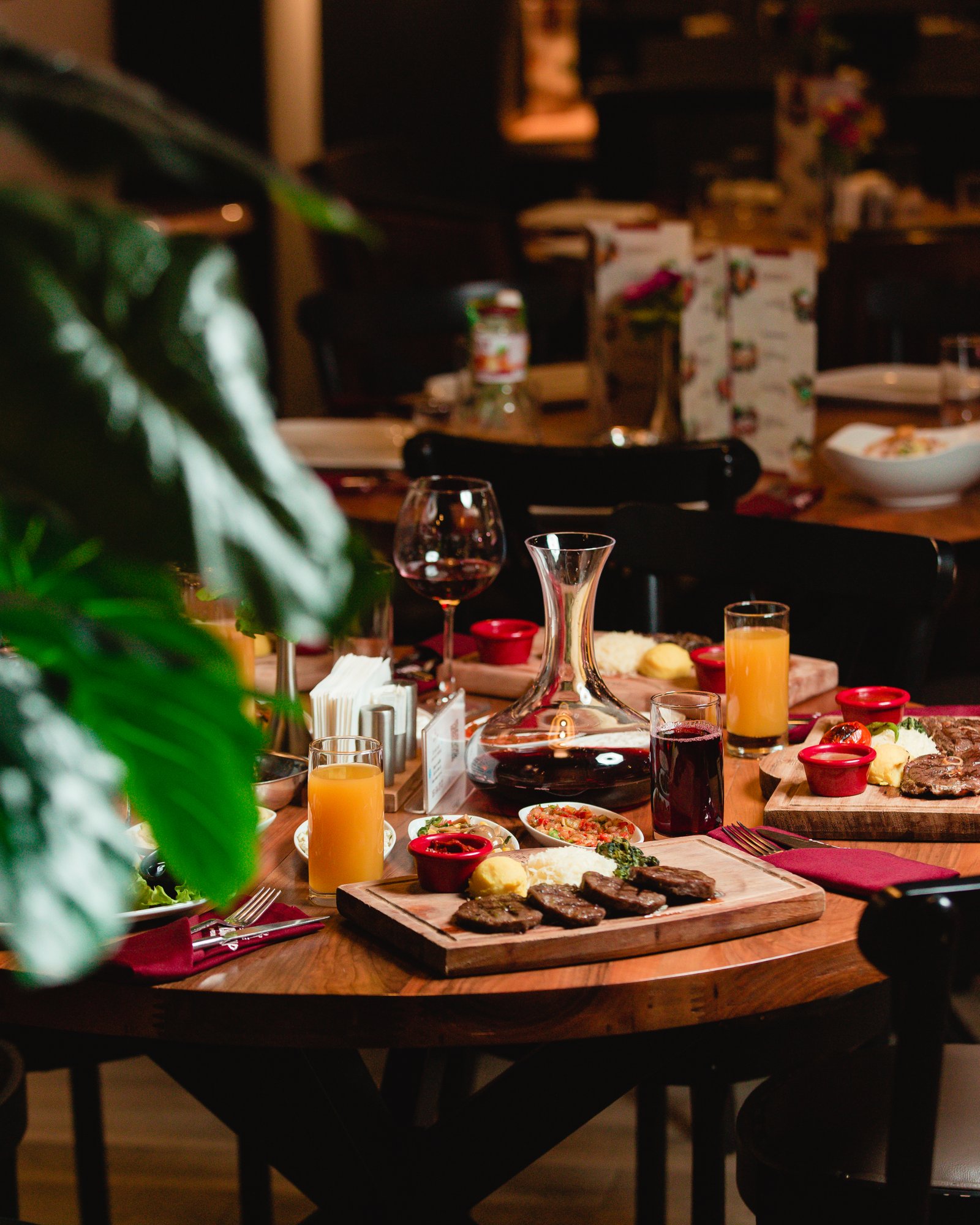 Dinner table with foods and soft drinks at restaurant
